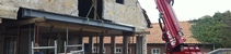 Balk in achtergevel boerderij hijsen